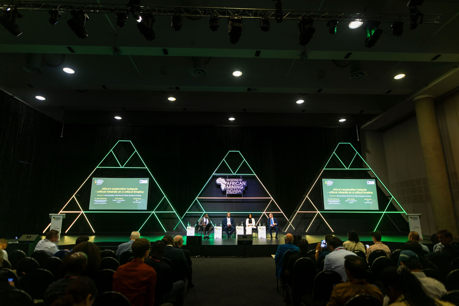 A wide view of a conference stage and audience